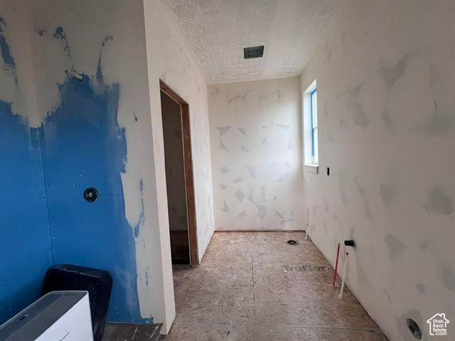 Bathroom featuring a textured ceiling