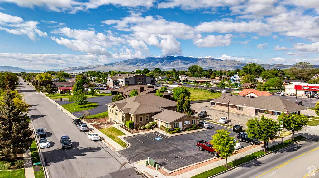 Aerial view of residential area featuring a mountainous background
