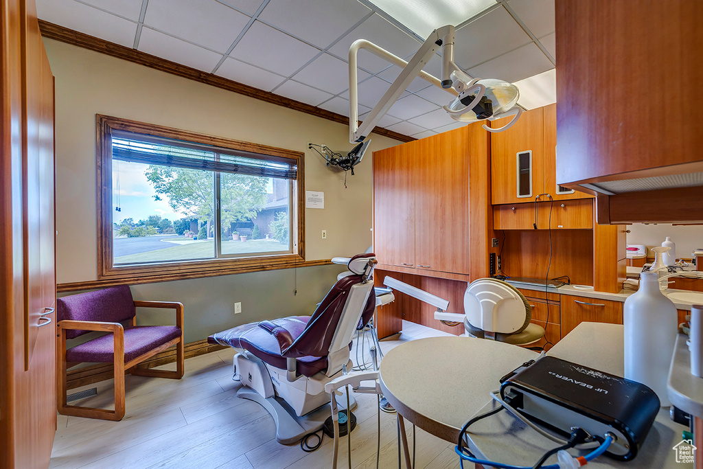 Interior space featuring light wood-style floors and crown molding