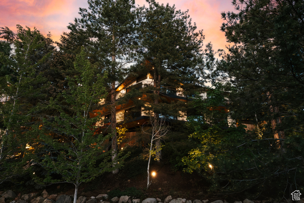 View of property exterior at dusk
