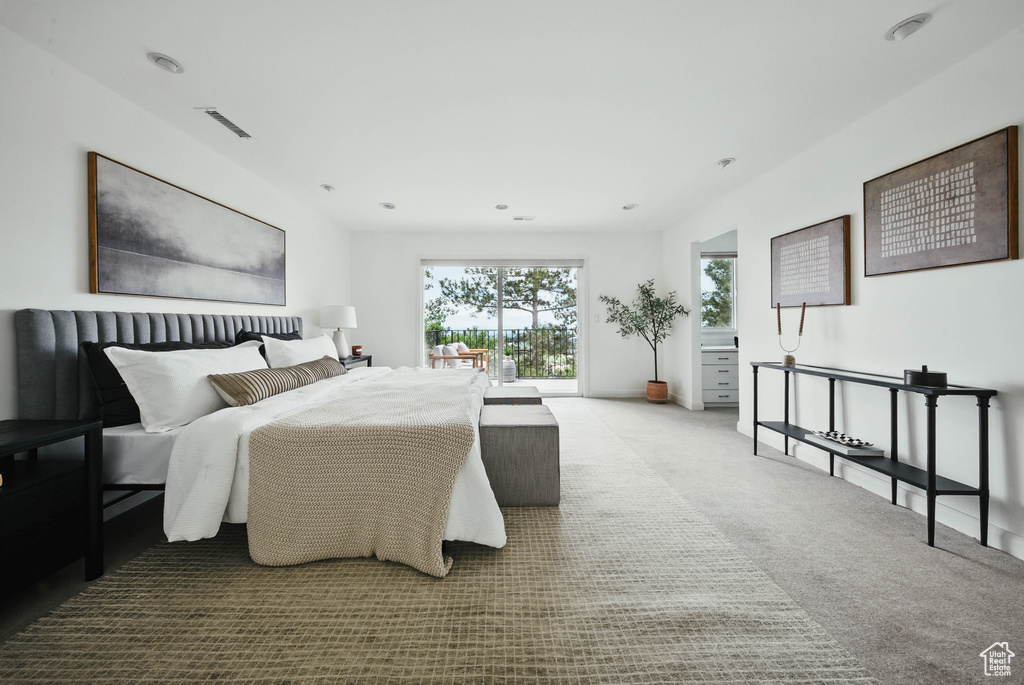 Bedroom featuring carpet and access to exterior