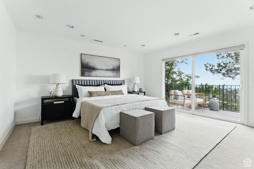 Bedroom featuring access to outside, carpet floors, baseboards, and recessed lighting