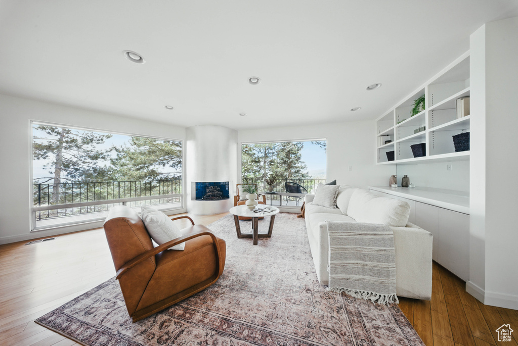 Living room featuring wood finished floors and recessed lighting