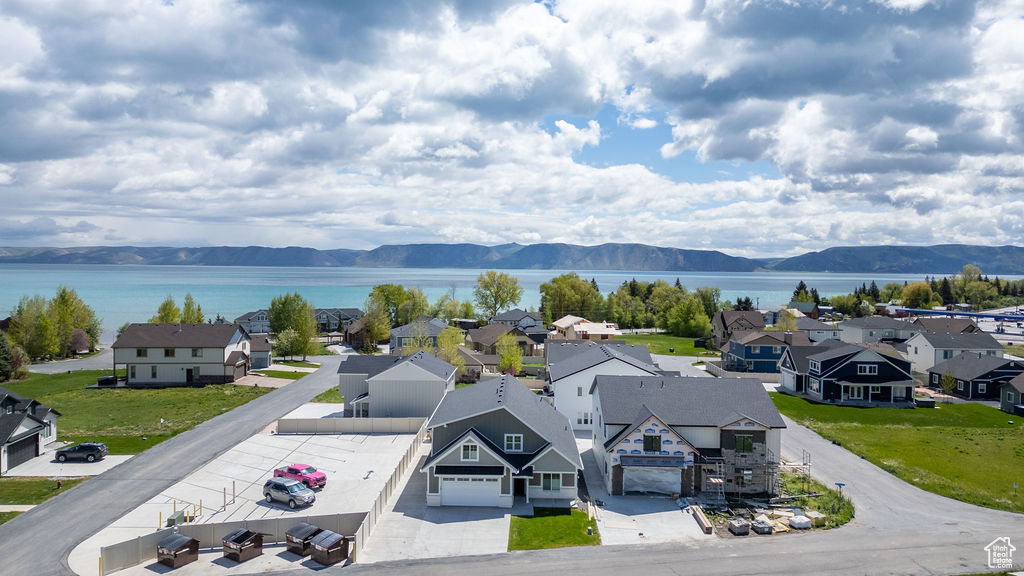 Aerial perspective of suburban area with a water and mountain view