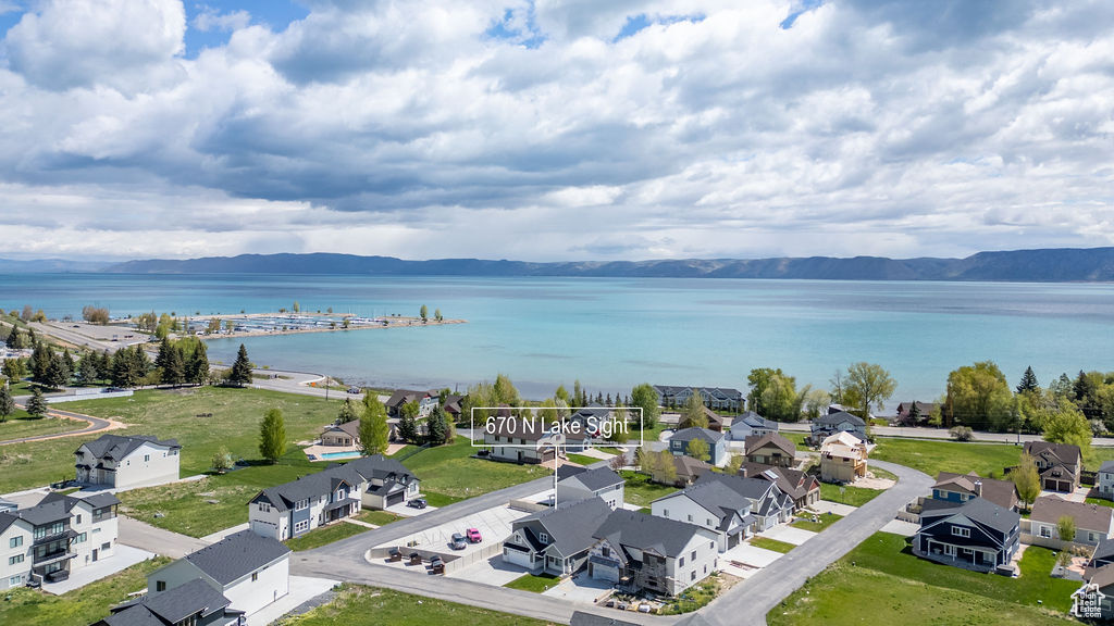 Aerial view of residential area featuring a water and mountain view