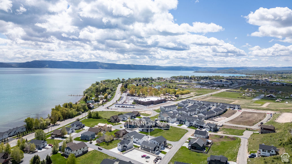 Aerial perspective of suburban area featuring a water and mountain view