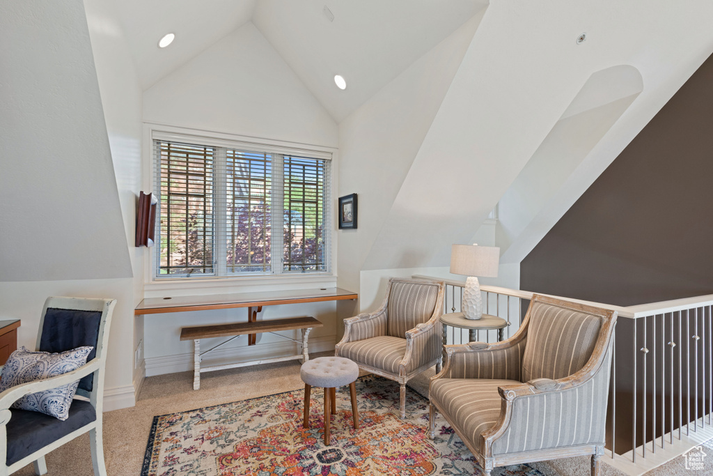 Living area featuring carpet, high vaulted ceiling, recessed lighting, and baseboards