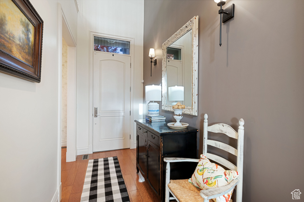 Bathroom with wood finished floors and baseboards