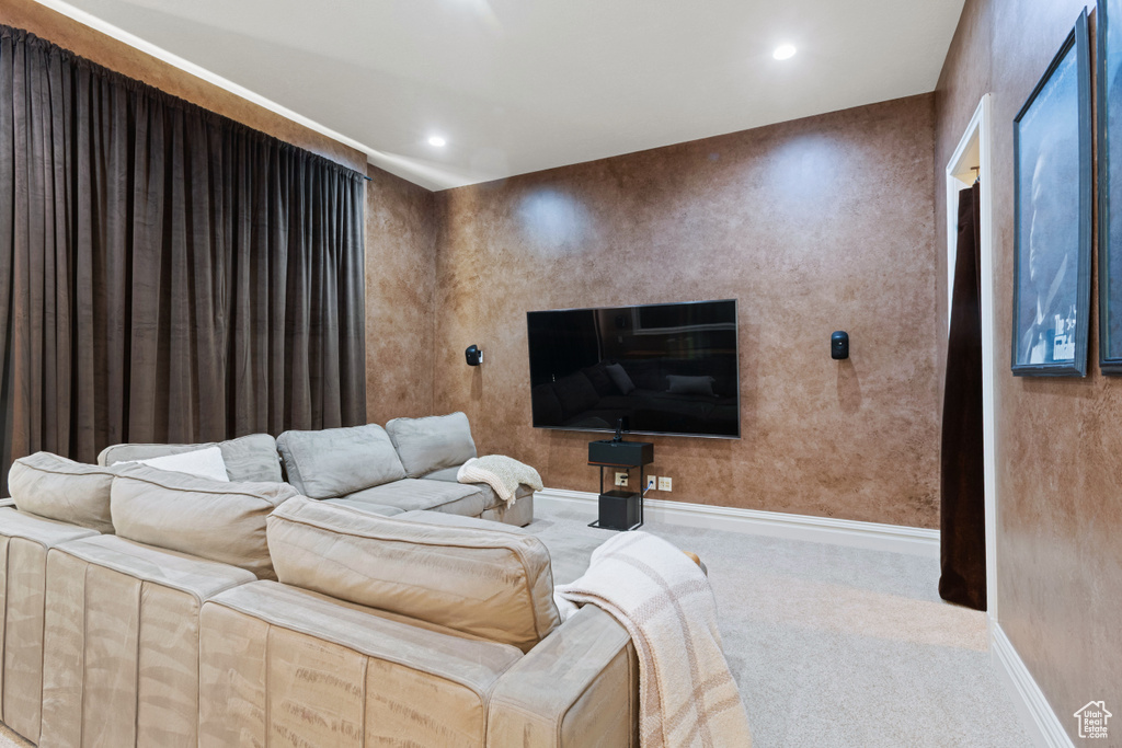 Home theater featuring carpet, baseboards, and recessed lighting
