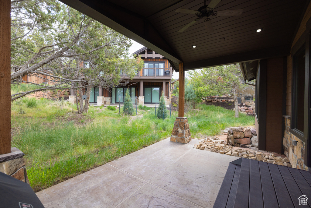 View of patio featuring ceiling fan