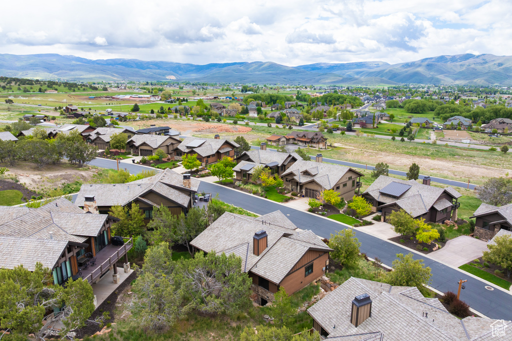 Aerial perspective of suburban area featuring a mountainous background