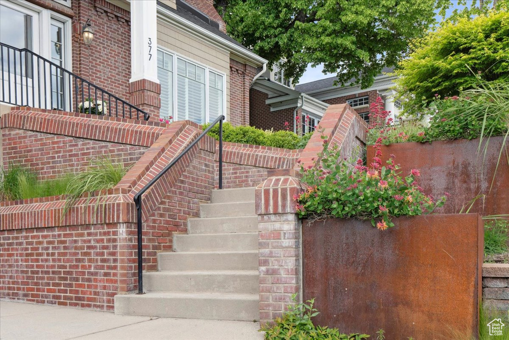 Property entrance featuring brick siding