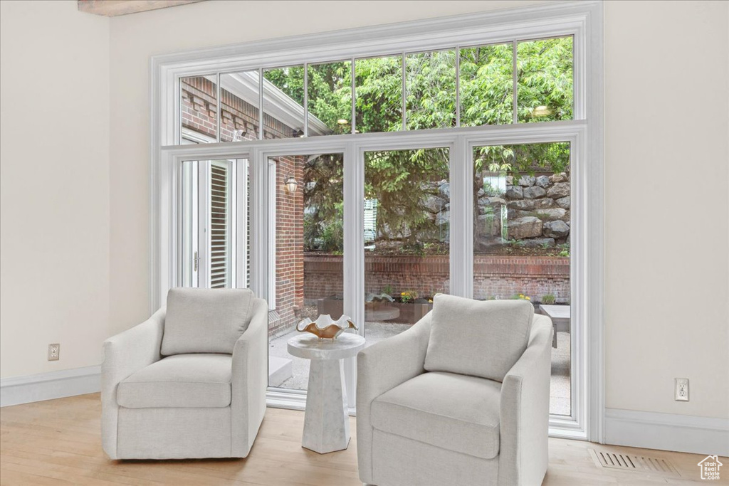Sitting room featuring baseboards and light wood finished floors