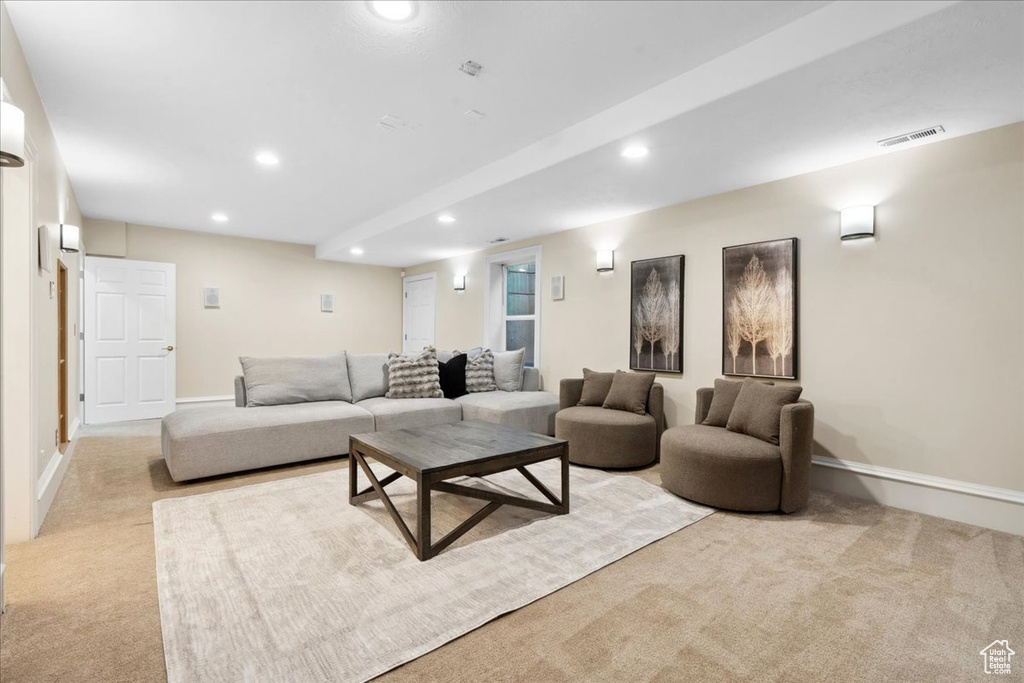 Living room with carpet floors, recessed lighting, and baseboards