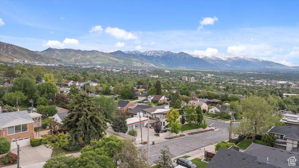 Aerial perspective of suburban area featuring a mountainous background