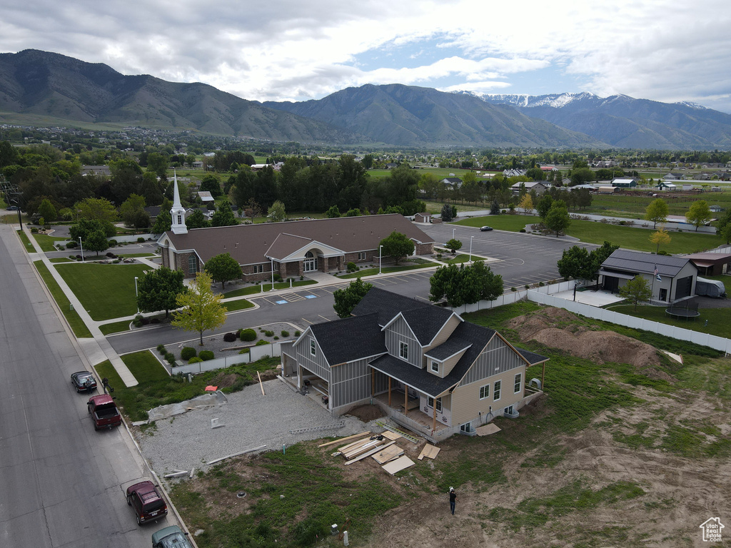 Aerial view of property and surrounding area featuring mountains