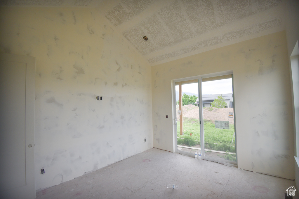 Spare room with lofted ceiling