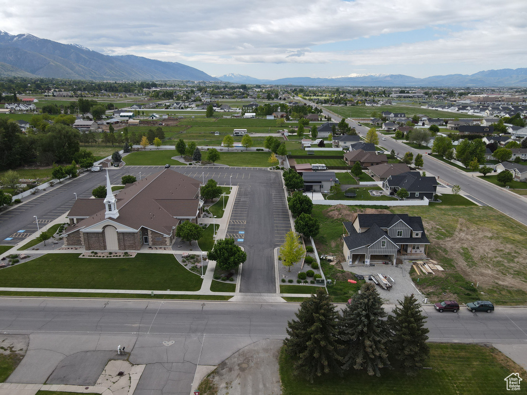 Aerial perspective of suburban area featuring a mountainous background