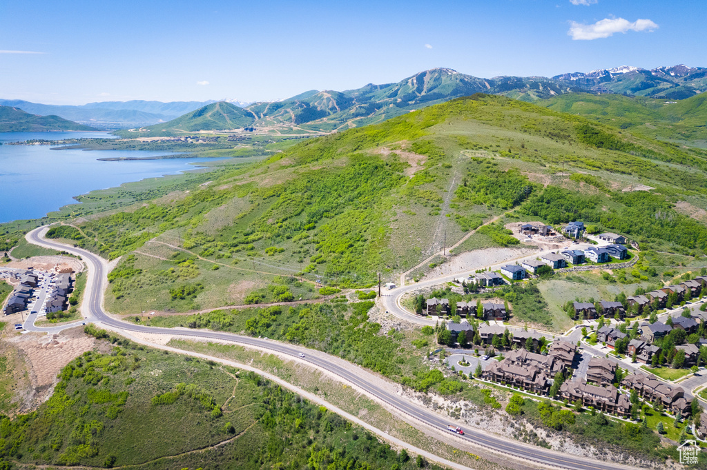 View of property location featuring a water and mountain view