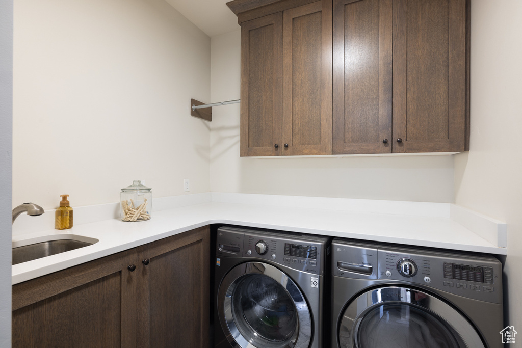 Laundry room with cabinet space and independent washer and dryer