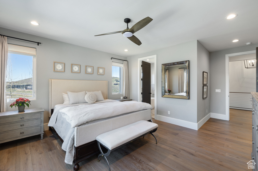 Bedroom with baseboards, wood finished floors, recessed lighting, and a ceiling fan