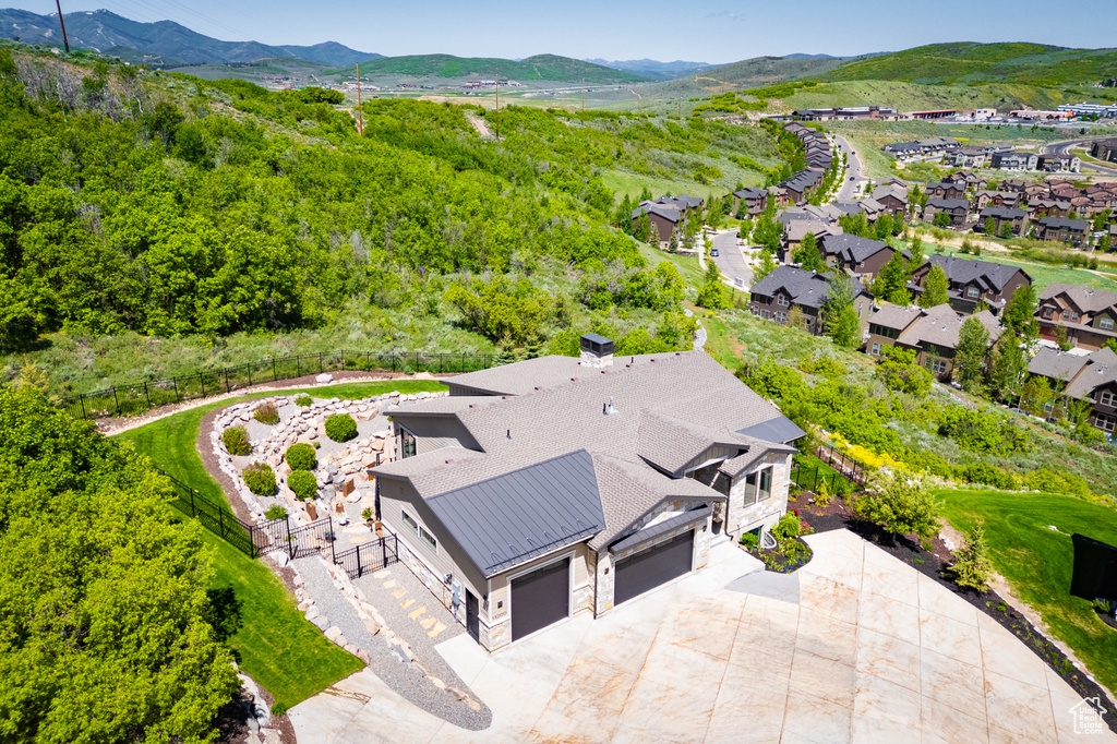 View from above of property with a mountain backdrop