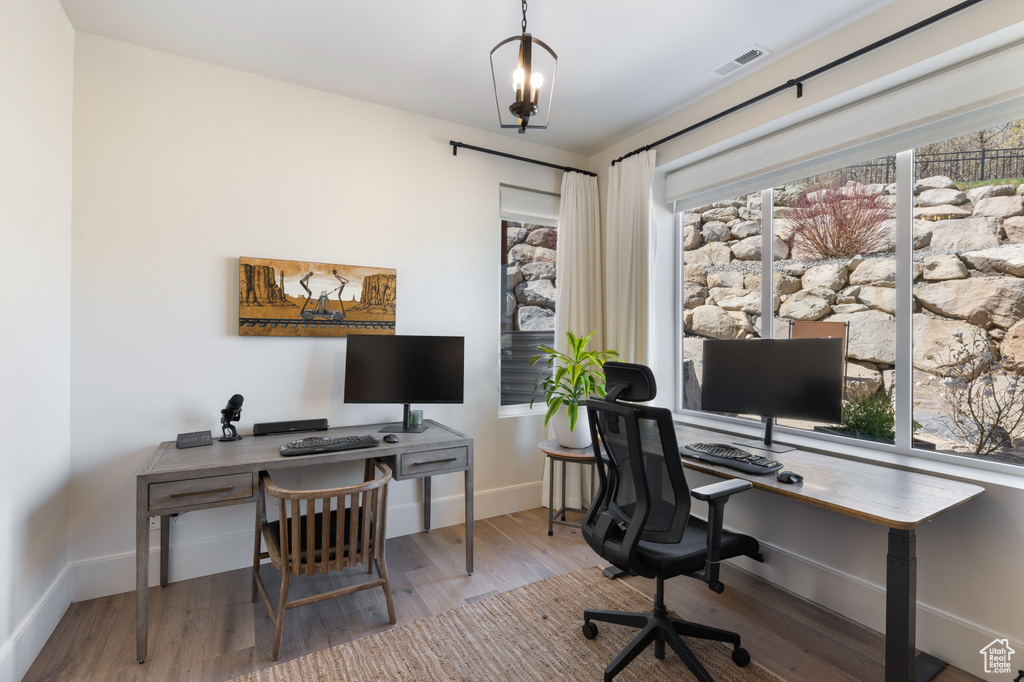 Office area featuring wood finished floors and baseboards