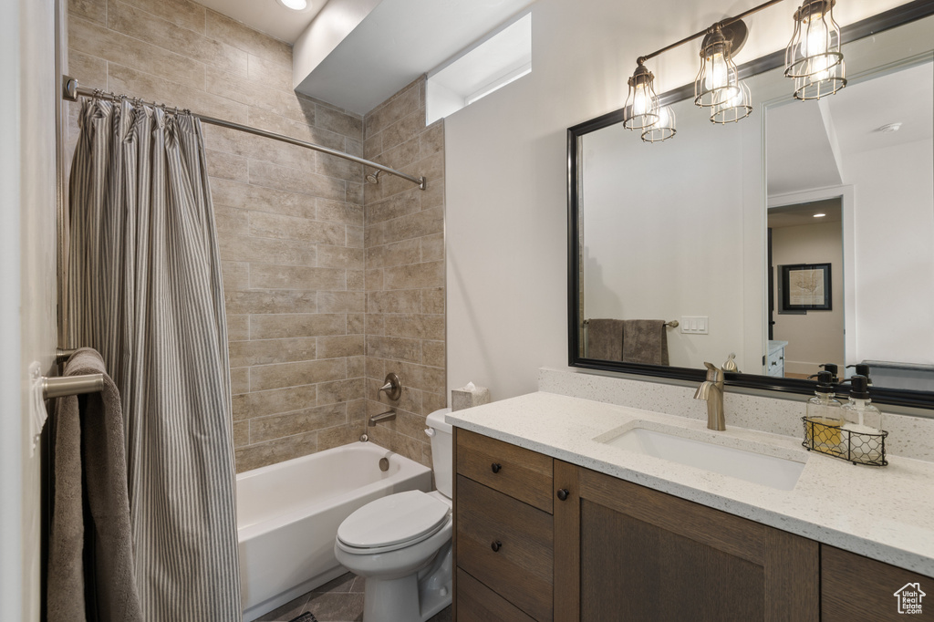 Full bathroom with vanity, shower / bath combination with curtain, and toilet