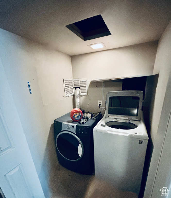Laundry room with washing machine and dryer