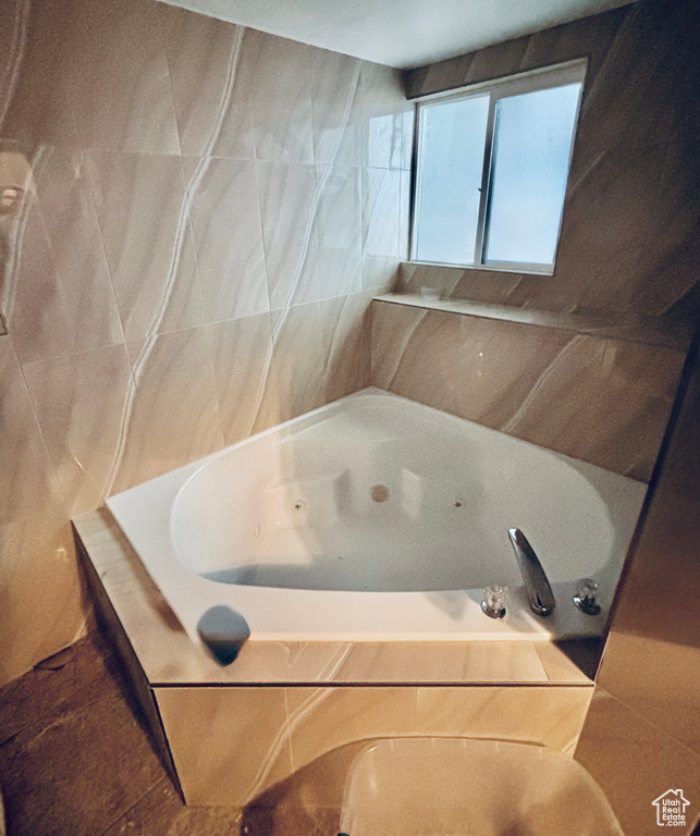 Bathroom with a tub with jets
