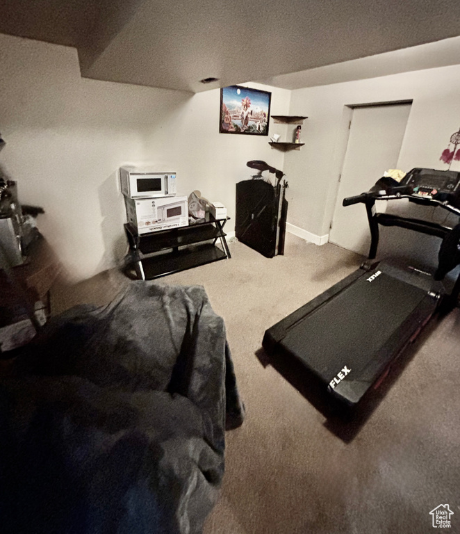 Workout room with carpet flooring