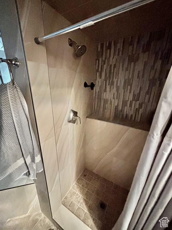 Full bath with a shower stall