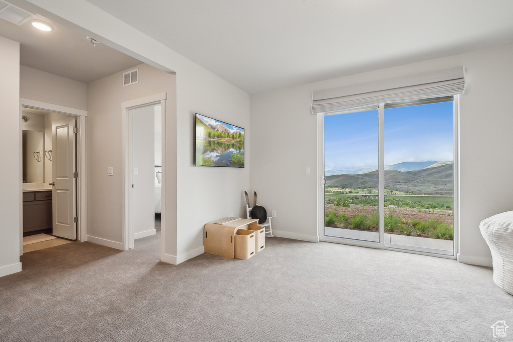 Bedroom with access to exterior, a mountain view, carpet, baseboards, and recessed lighting