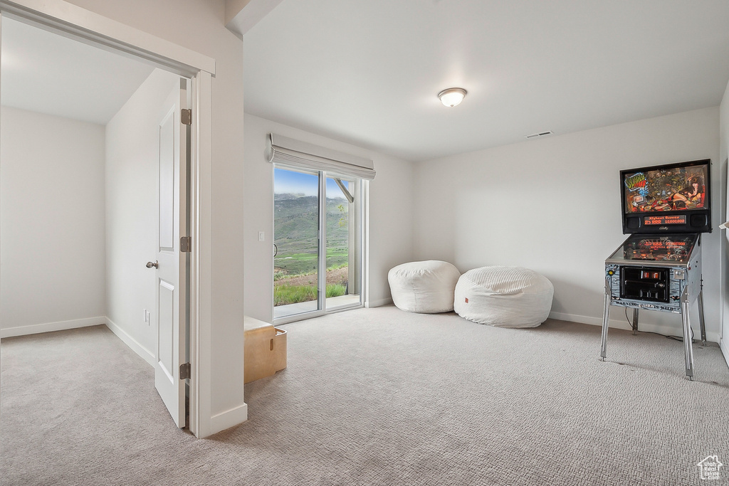 Living area with carpet floors and baseboards