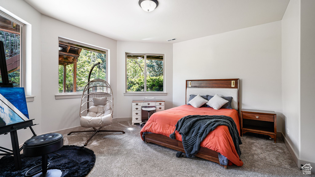 Carpeted bedroom with baseboards
