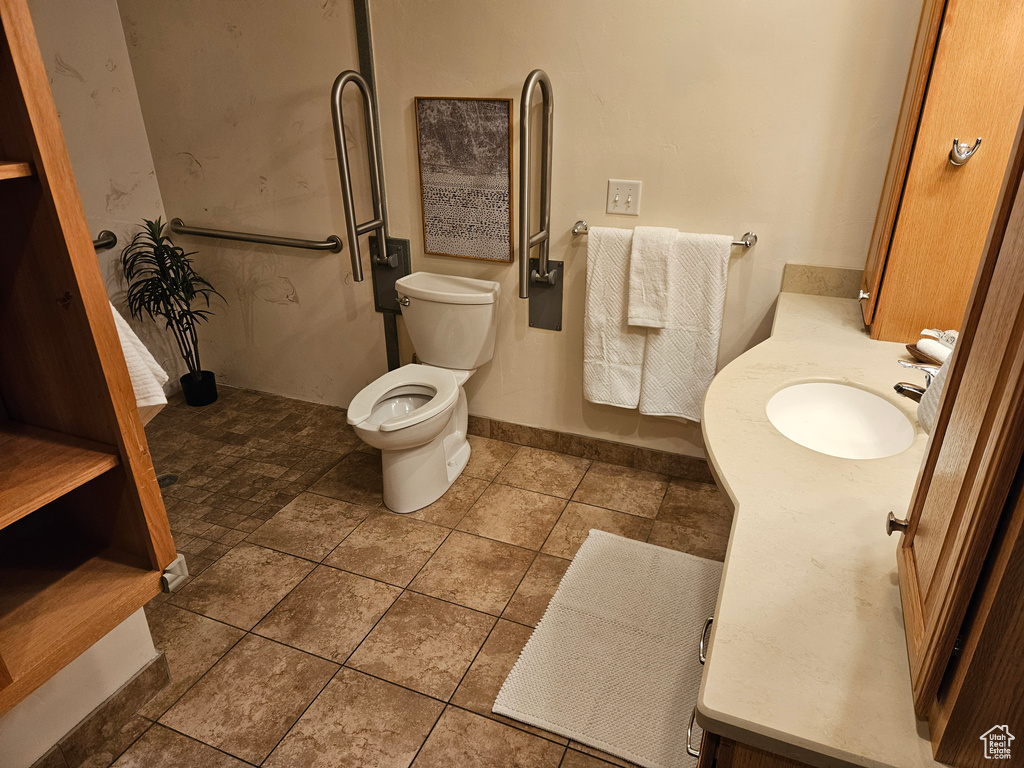 Bathroom with vanity and tile patterned floors