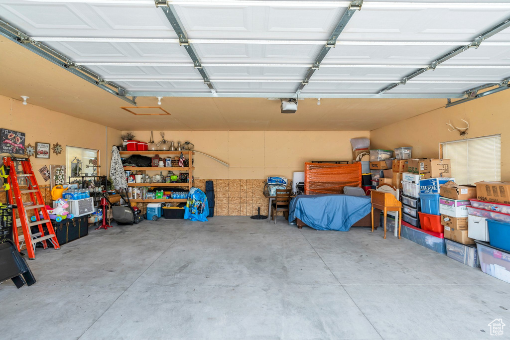 Garage featuring a garage door opener