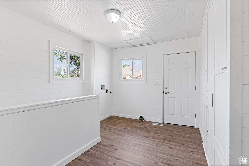 Entryway featuring dark wood-style floors and baseboards