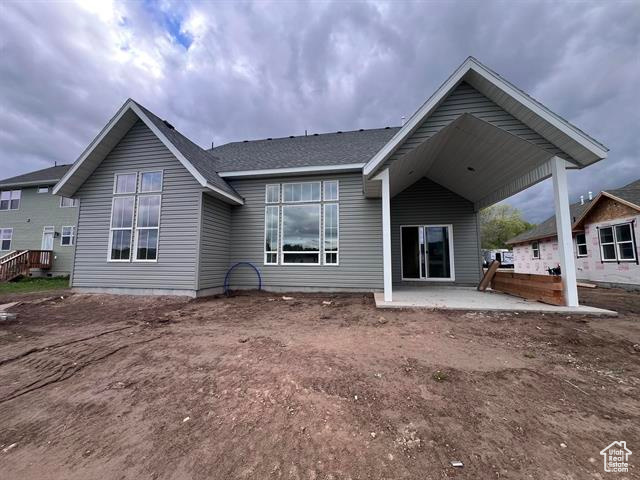 Back of house with a patio