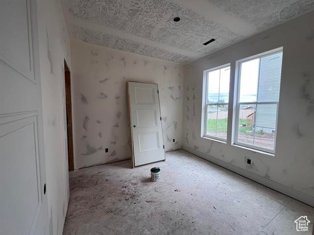 Empty room with a textured ceiling