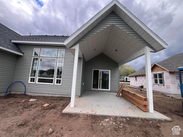 Rear view of house with a patio area