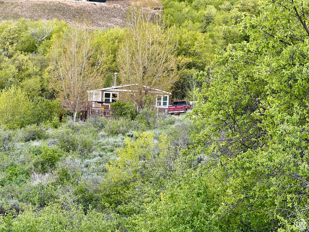 View of sport court with a wooded view