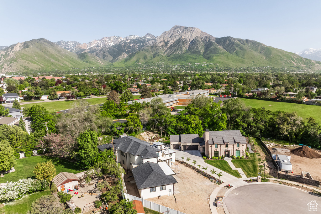View of mountain backdrop featuring nearby suburban area