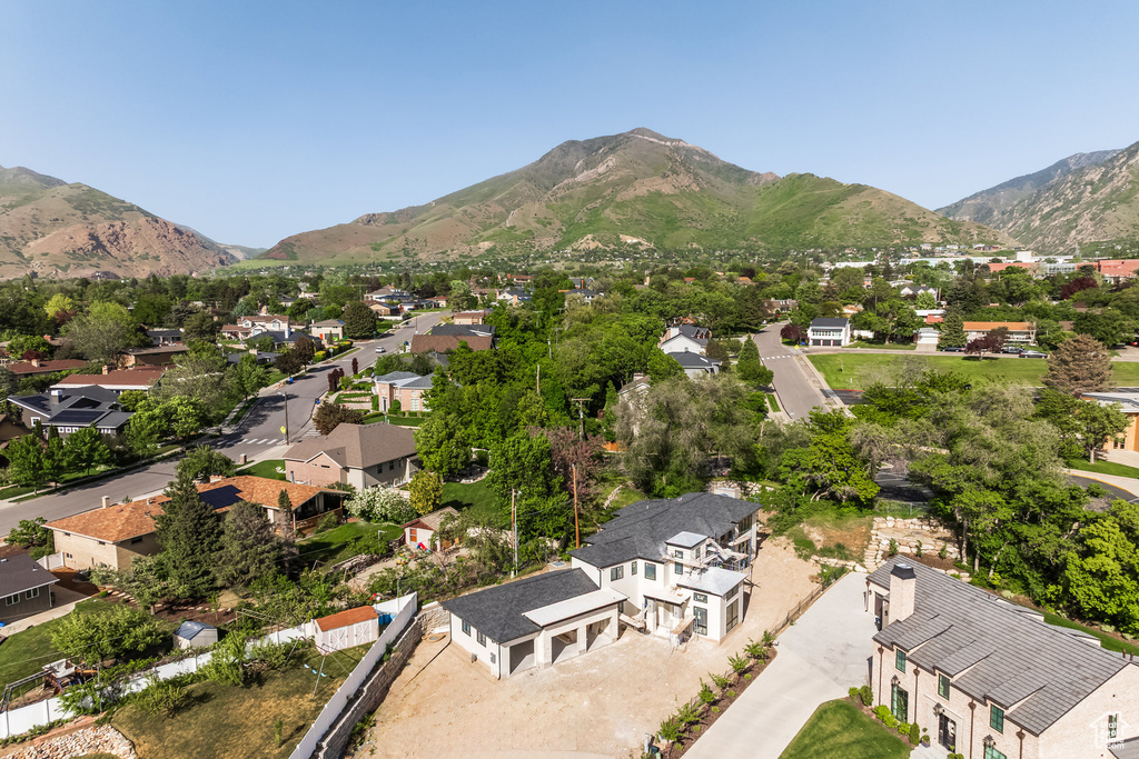 Aerial perspective of suburban area with a mountain backdrop