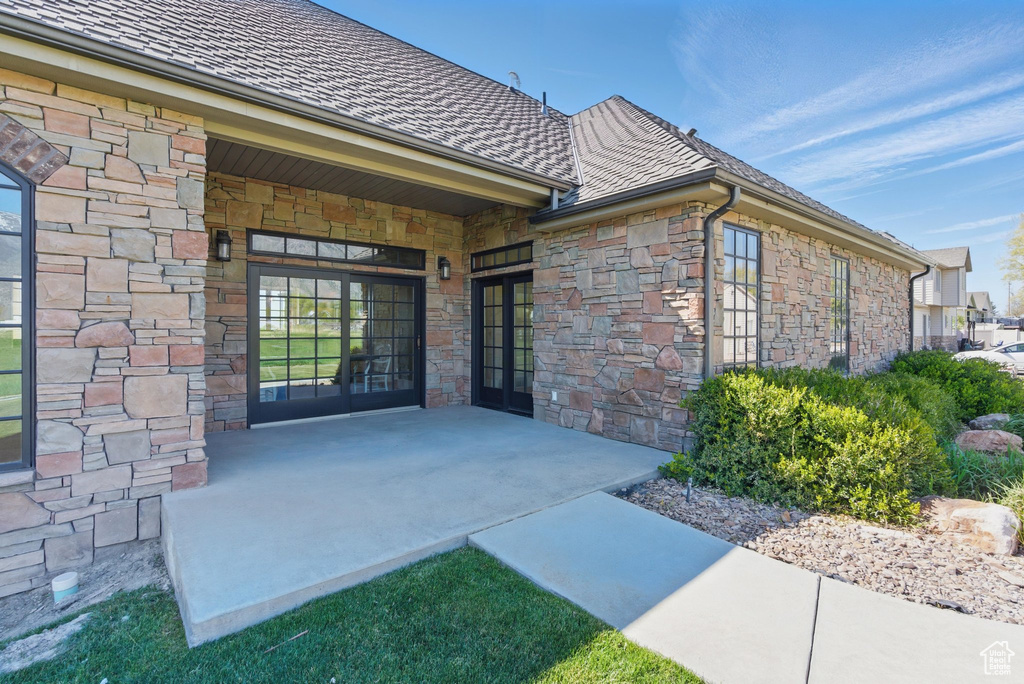 View of exterior entry with stone siding