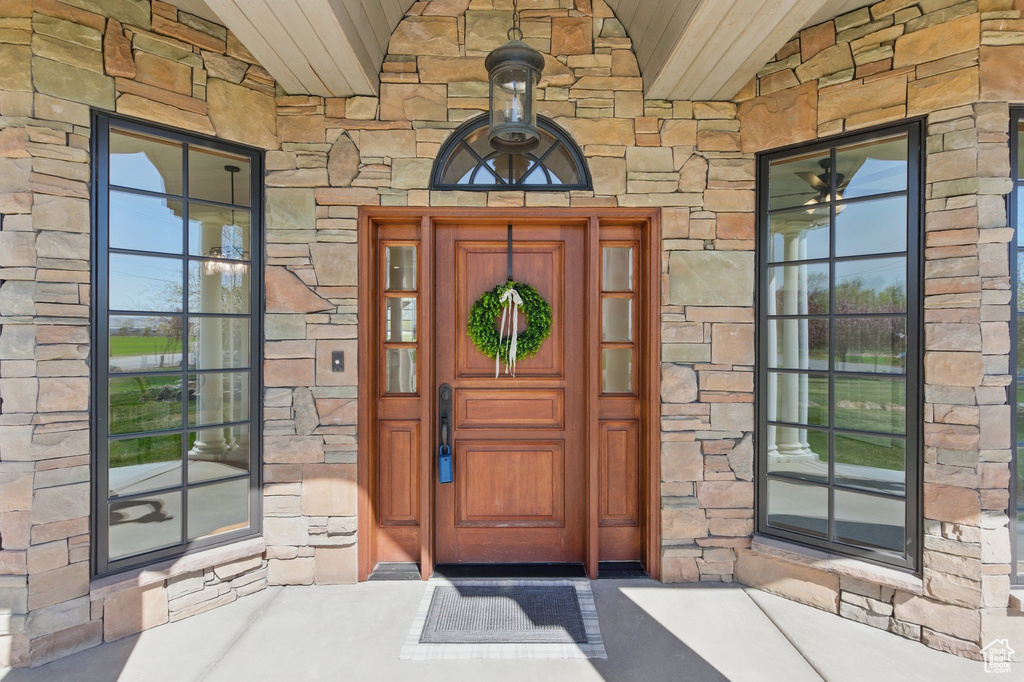 Entrance to property with stone siding