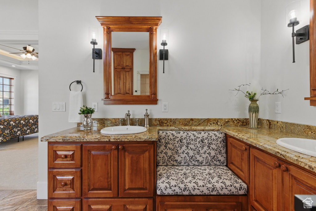 Full bath featuring vanity and a ceiling fan