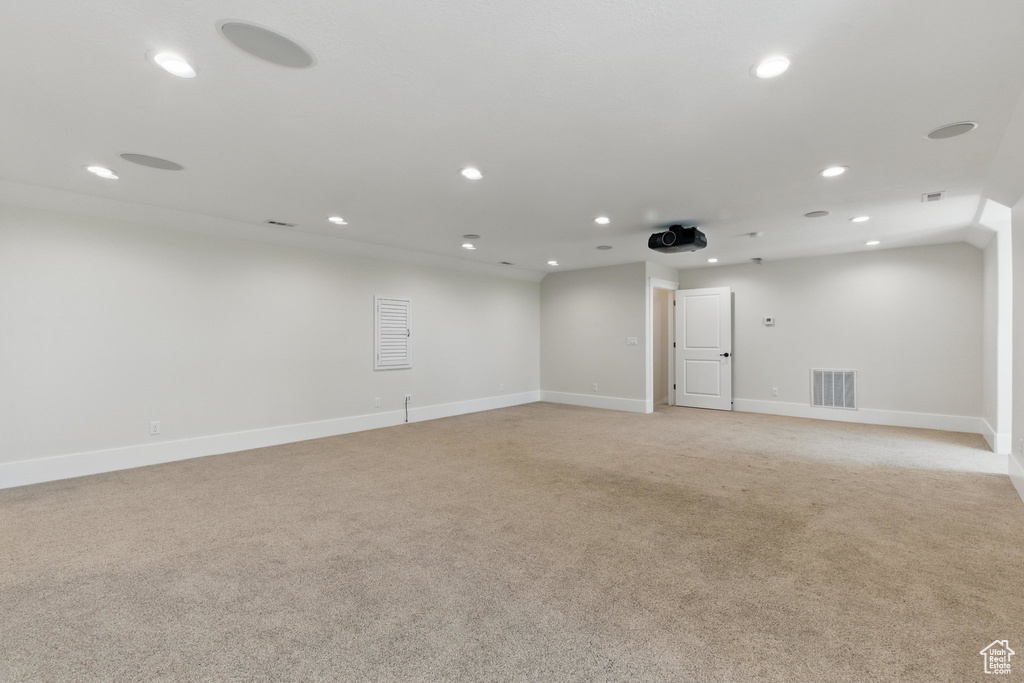 Spare room with light colored carpet, baseboards, visible vents, and recessed lighting