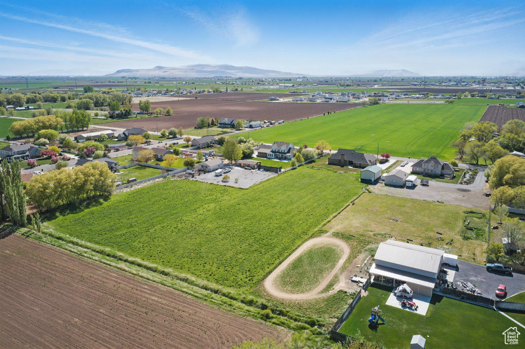 Birds eye view of property with a rural view and a mountain view