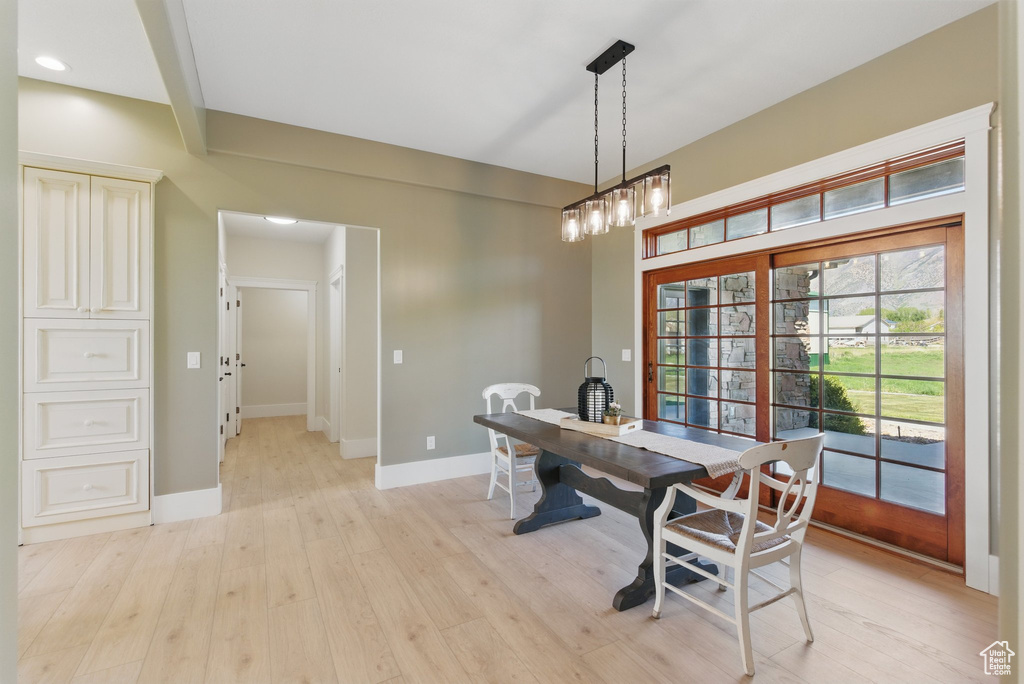 Dining space with light wood-style floors, baseboards, and recessed lighting